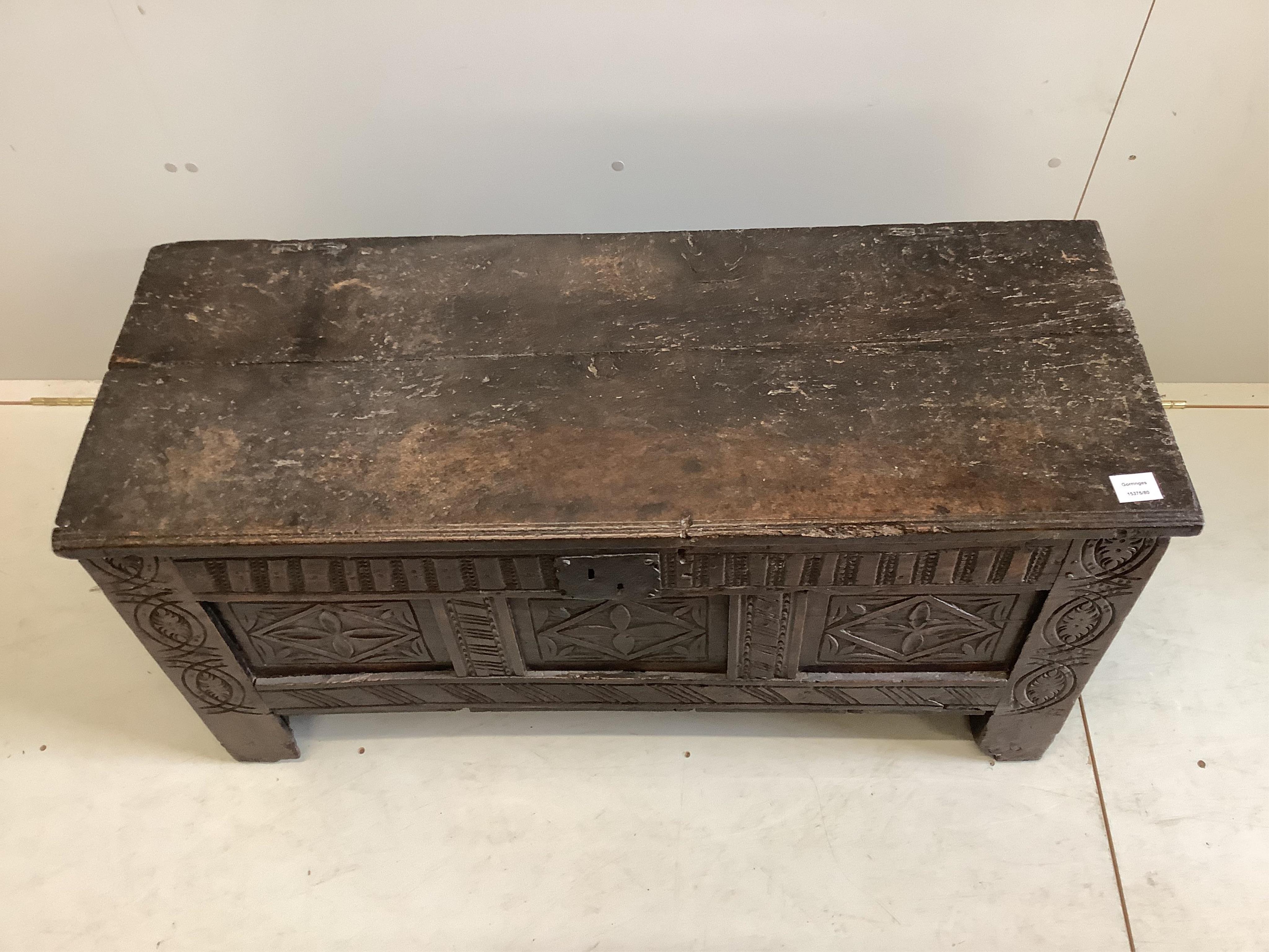 A 17th century triple panelled carved oak coffer, width 109cm, depth 42cm, height 54cm. Condition - poor-fair